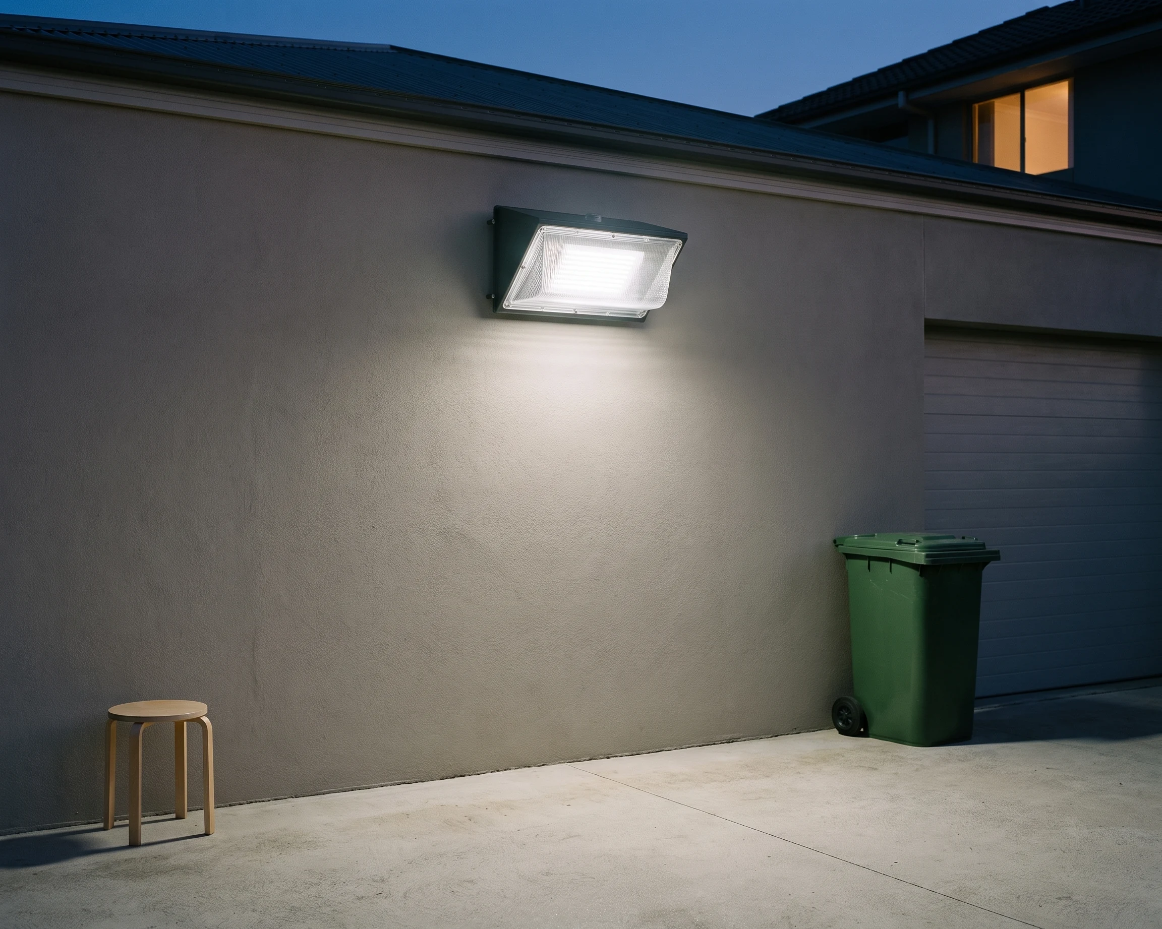 Dusk-to-dawn wall pack, shown in a typical installation (illustration)